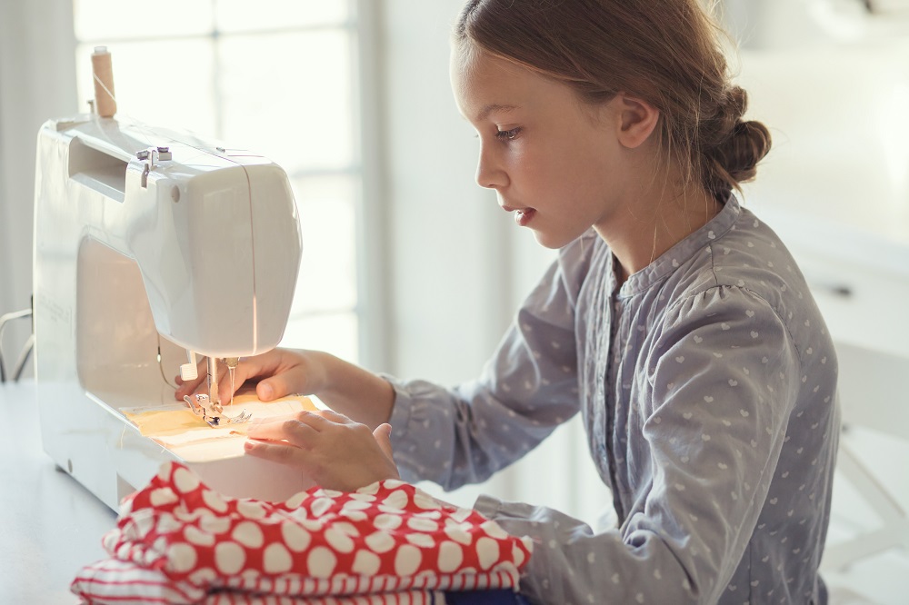 Child at Sewing Machine